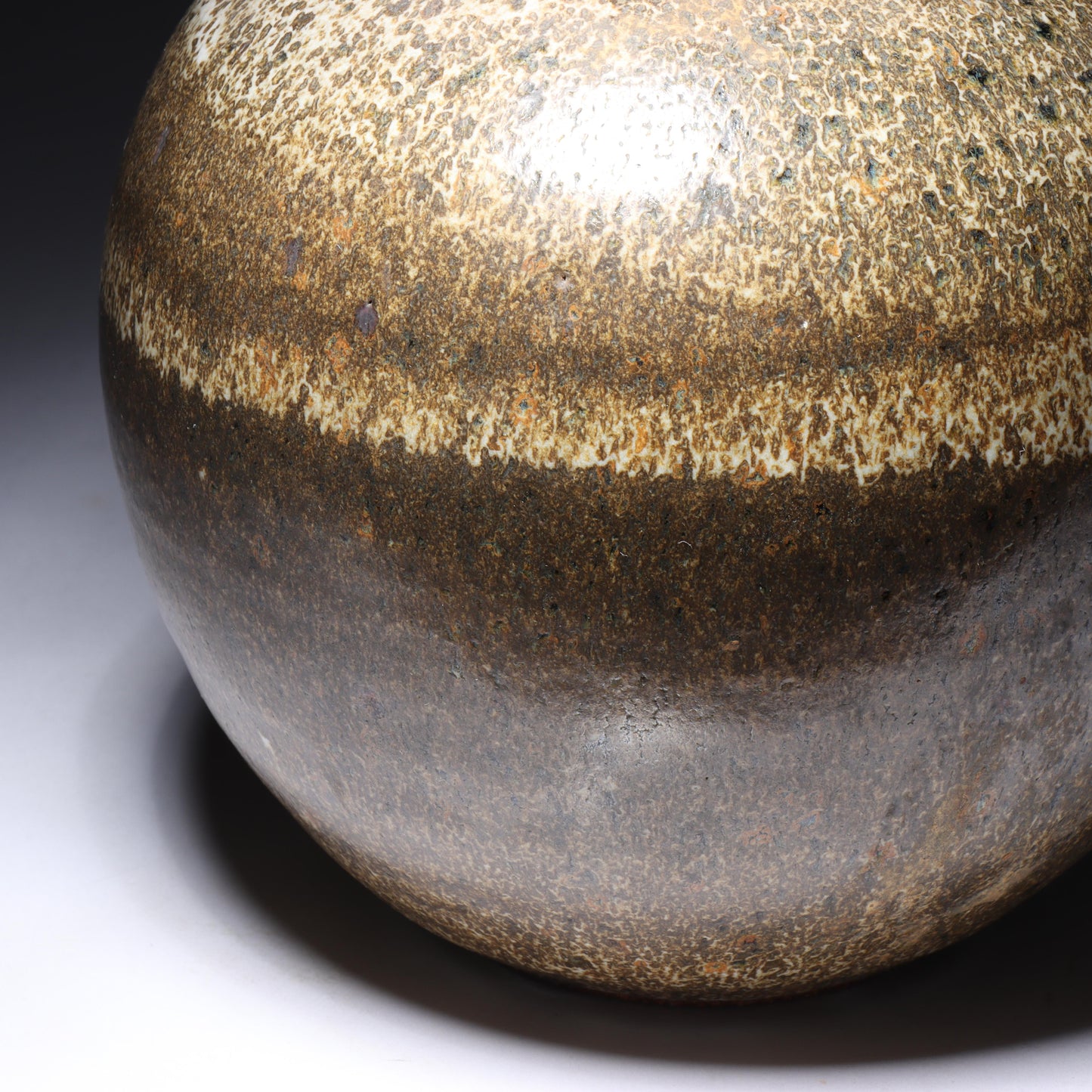 Laura Andreson, California (1902 - 1999), American studio pottery pinch neck bulbous vase, 1979, stoneware mottled banded earthtone glaze, 7 3/4"H x 6 1/2"Diam.