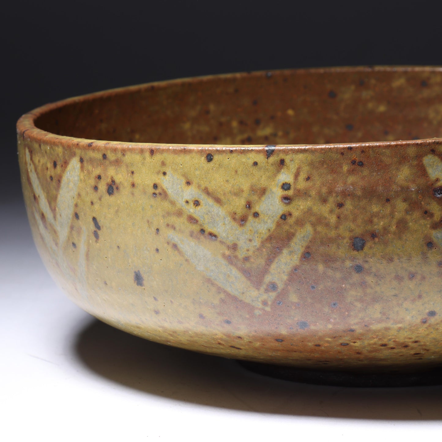 Laura Andreson, California (1902 - 1999), American studio pottery bowl, 1955, stoneware with mustard over brown glaze and spatter with painted mark pattern, 3"H x 8 1/4"Diam.