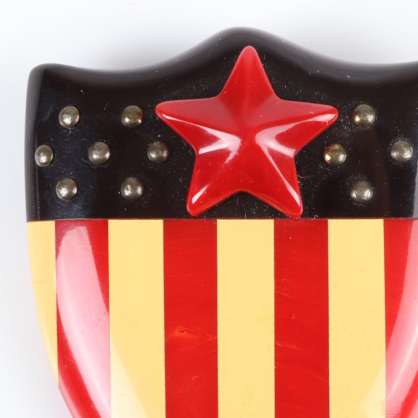 Vintage Bakelite RARE Patriotic American flag shield pin brooch, laminated stripes with applied star and metal studs. 2 1/2" X 2" W