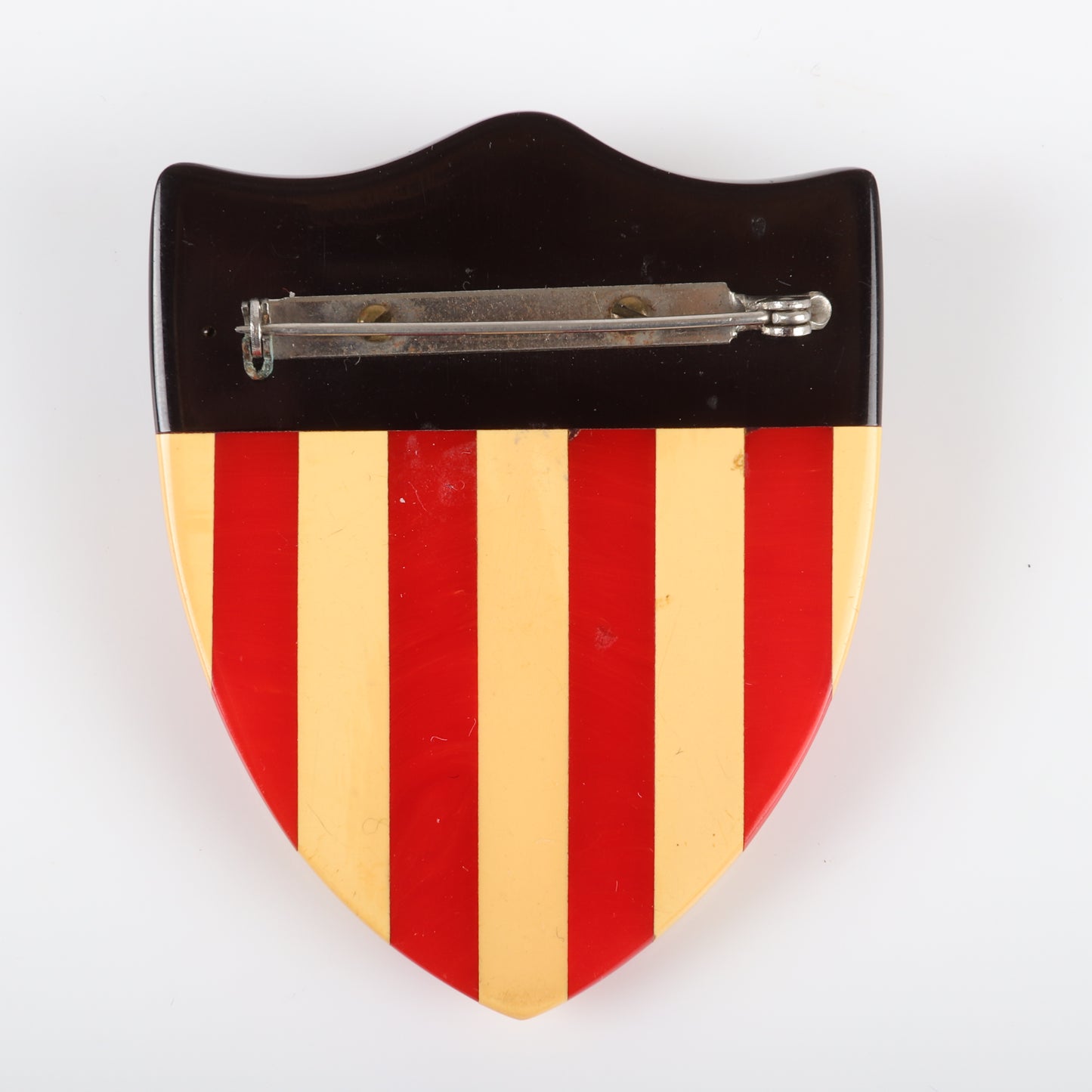 Vintage Bakelite RARE Patriotic American flag shield pin brooch, laminated stripes with applied star and metal studs. 2 1/2" X 2" W