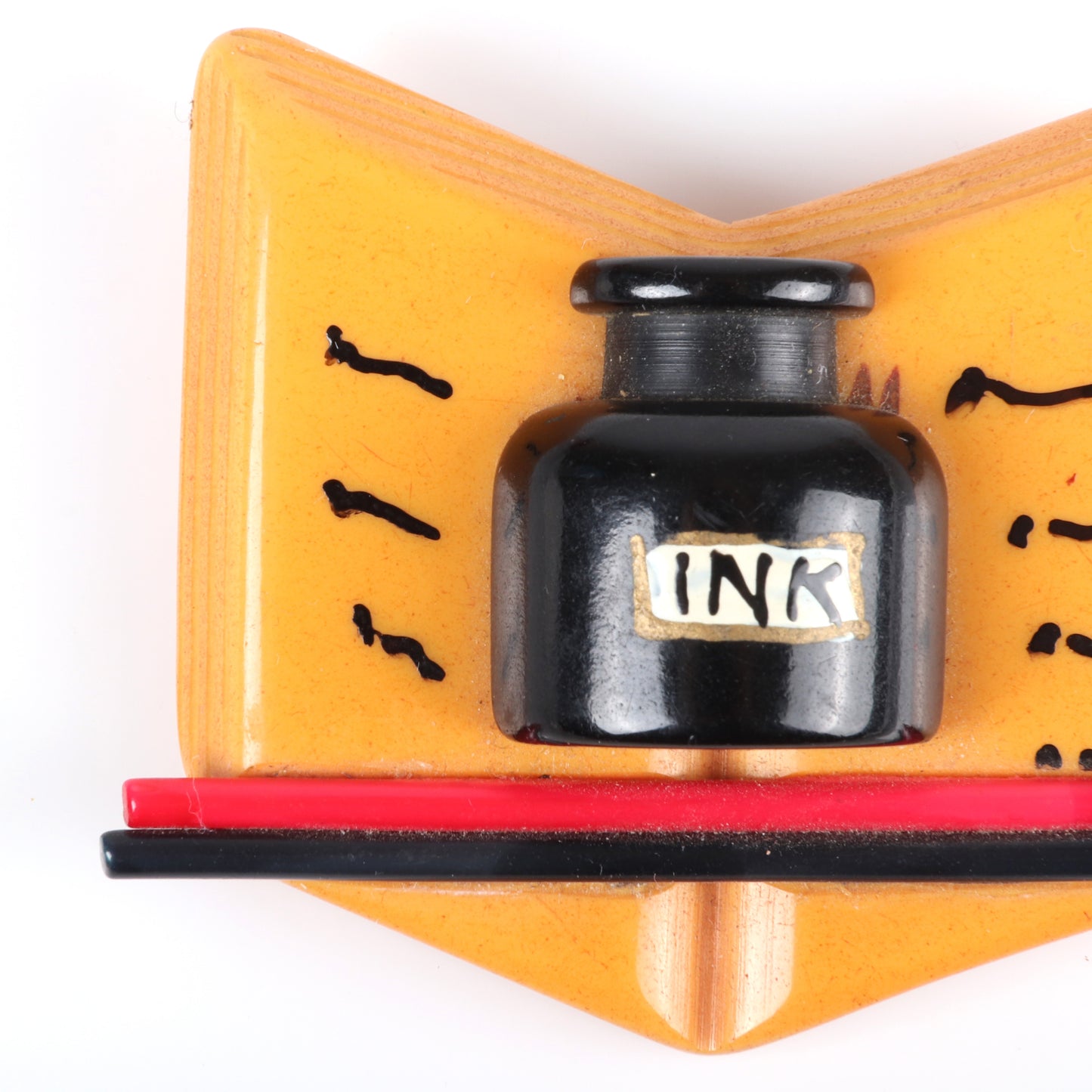 Vintage Bakelite carved School Days open book pin brooch. Figural book with applied ink bottle, pencils, and painted details. RARE book piece. 2 1/4" H x 3" W