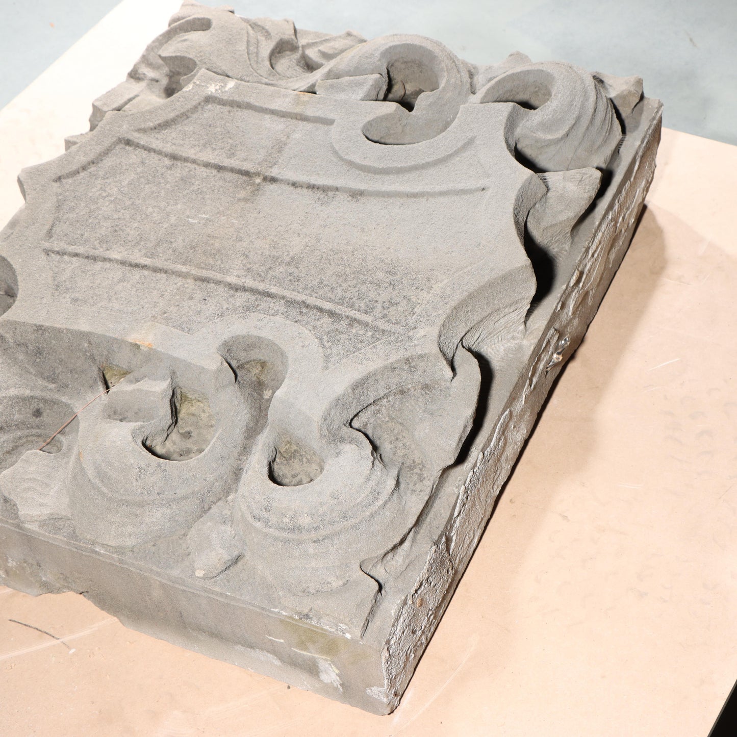 Shield form scrolled foliate relief border slab; 1920s Harlem, New York, Gothic Style Architectural Limestone Facade Carving 22 1/4"H x 27 1/2"W