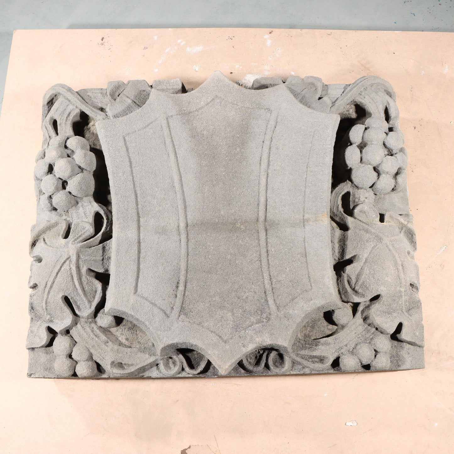 Shield form grape vine foliate relief border slab; 1920s Harlem, New York, Gothic Style Architectural Limestone Facade Carving 22 1/4"H x 28"W