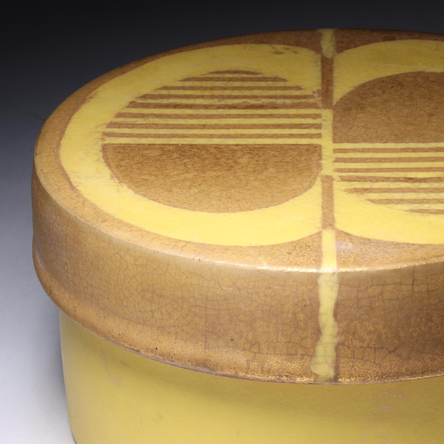 Laura Andreson, California (1902 - 1999), American studio pottery round covered porcelain box, 1975, porcelain, modernist painted design on lid in yellow and brown matte glazes, 3"H x 6"Diam.