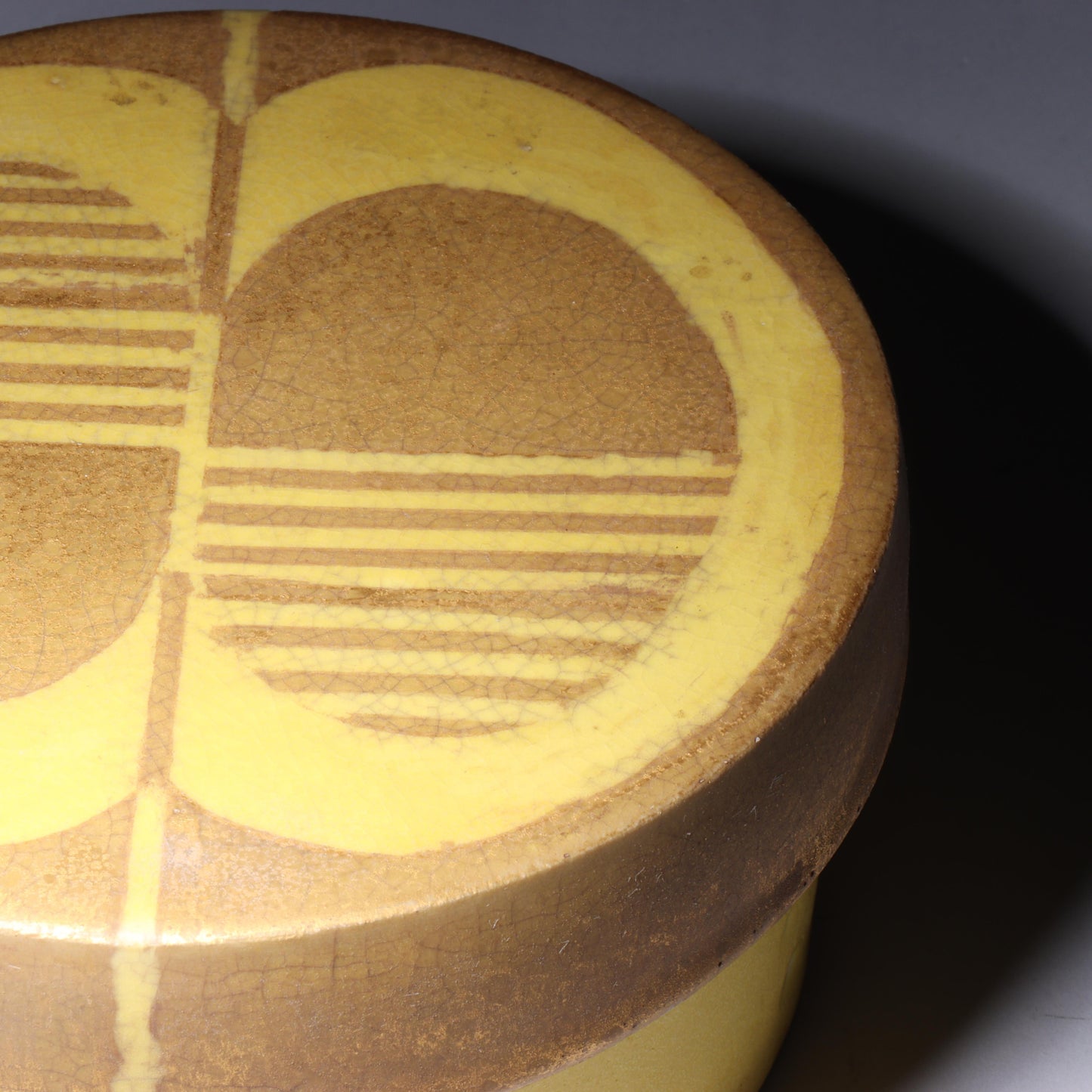 Laura Andreson, California (1902 - 1999), American studio pottery round covered porcelain box, 1975, porcelain, modernist painted design on lid in yellow and brown matte glazes, 3"H x 6"Diam.