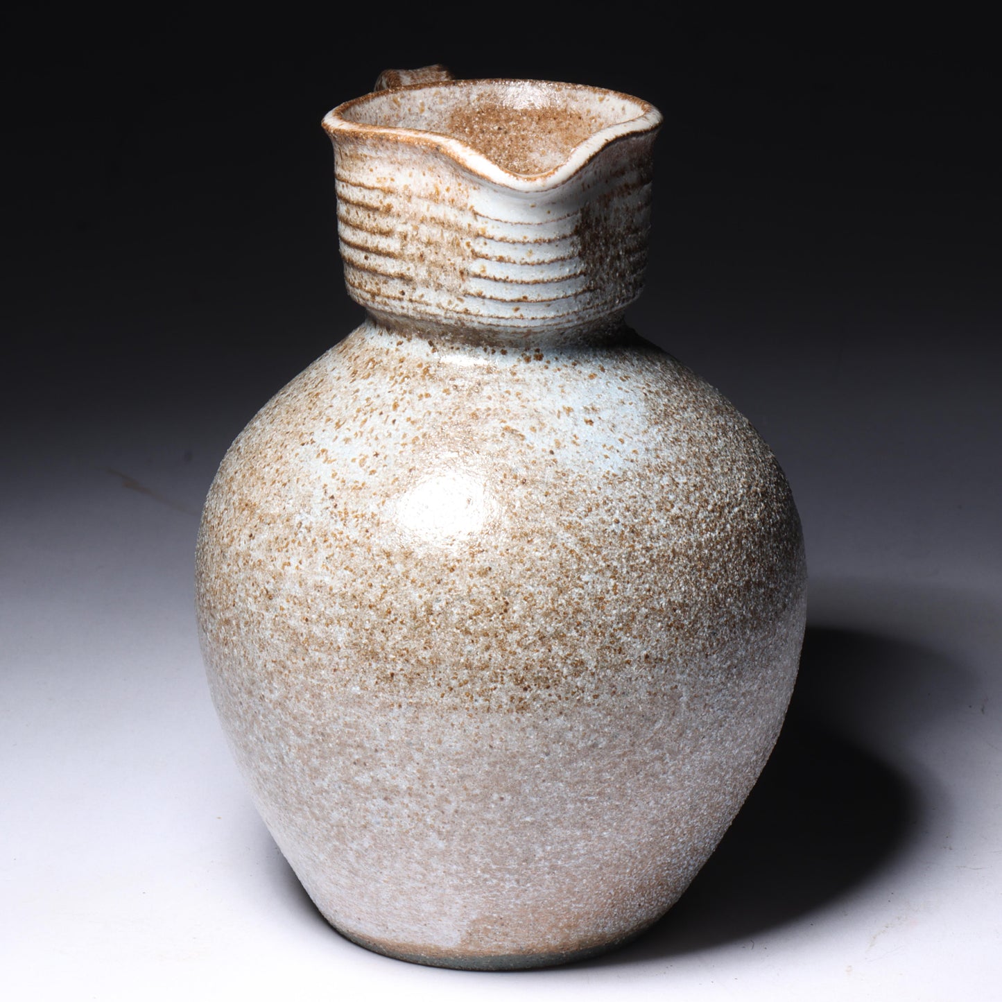 Laura Andreson, California (1902 - 1999), American studio pottery cream pitcher, 1951, bulbous form stoneware with shaped neck and ash glaze, 5 1/4"H x 4 1/2"W