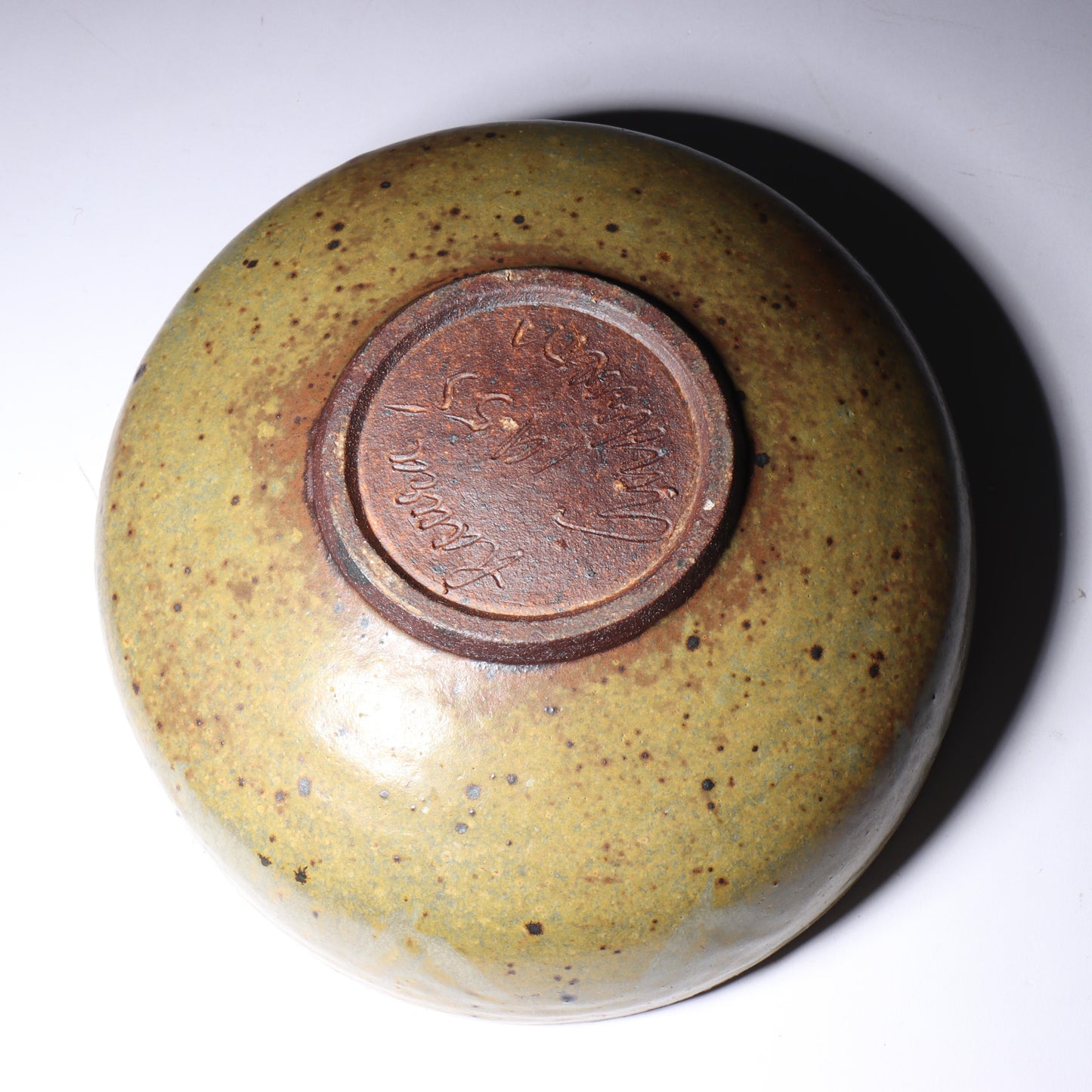 Laura Andreson, California (1902 - 1999), American studio pottery bowl, 1955, stoneware with mustard over brown glaze and spatter with painted mark pattern, 3"H x 8 1/4"Diam.