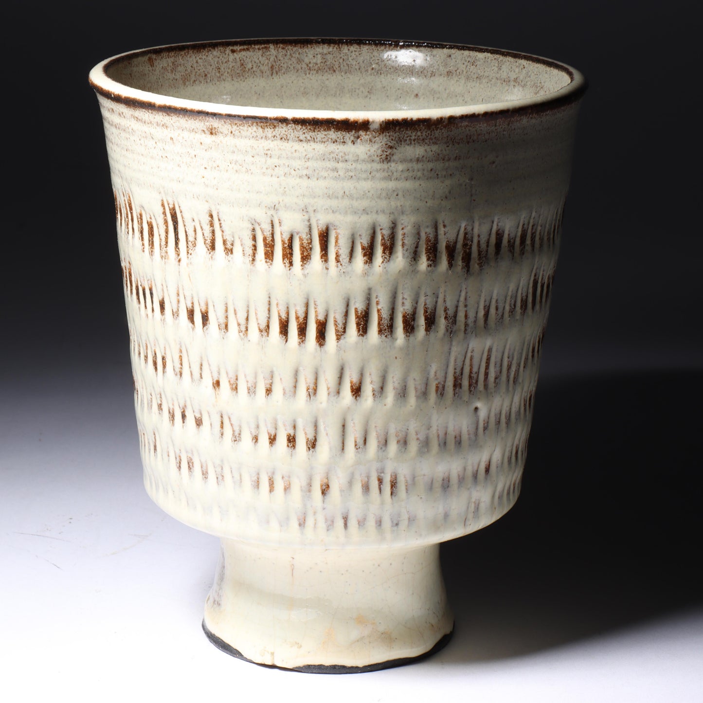 Laura Andreson, California (1902 - 1999), American studio pottery footed vessel, carved mark pattern, white over russet glaze ceramic, 6 1/4"H x 5 1/4"Diam.