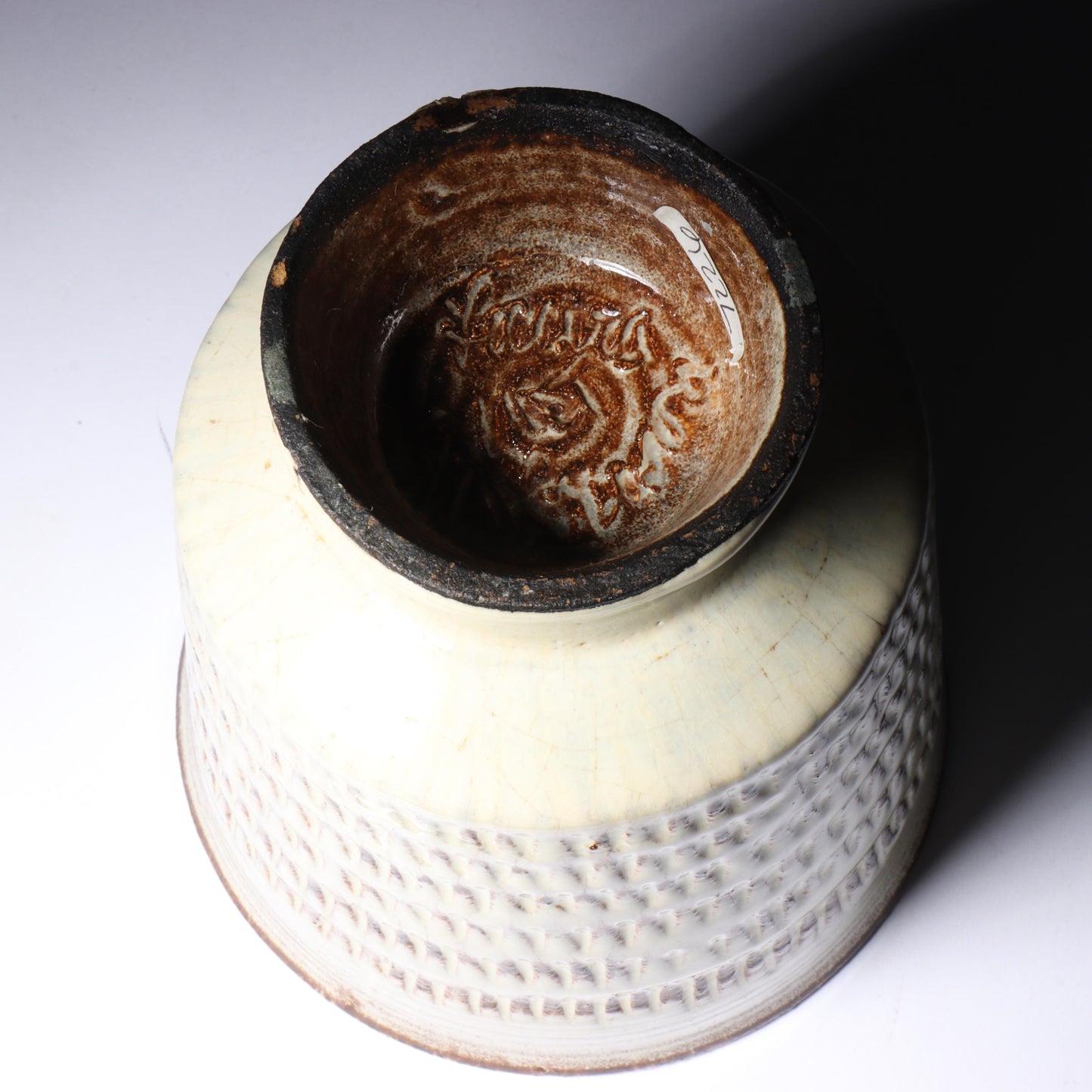 Laura Andreson, California (1902 - 1999), American studio pottery footed vessel, carved mark pattern, white over russet glaze ceramic, 6 1/4"H x 5 1/4"Diam.