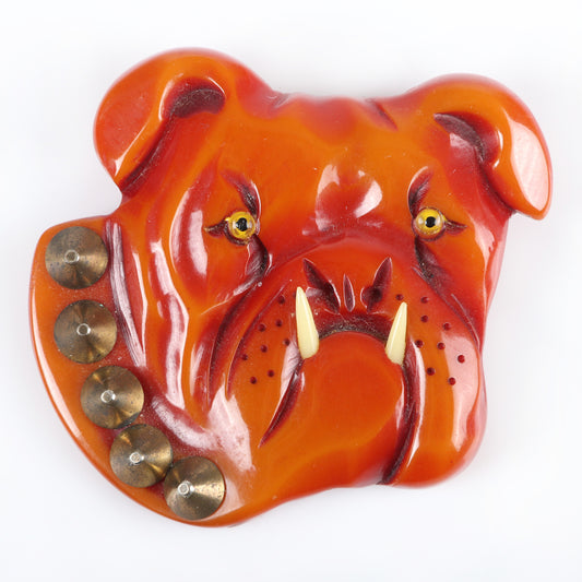 Vintage Bakelite RARE carved figural bulldog dog head pin brooch, over-dyed with glass eyes, applied celluloid teeth and metal stud collar. 2 1/2"H x 2 3/4"W
