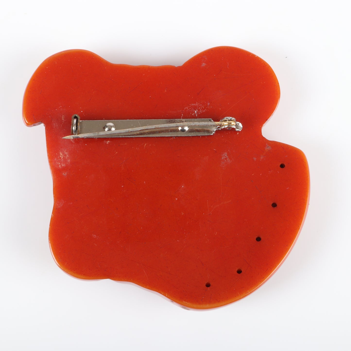 Vintage Bakelite RARE carved figural bulldog dog head pin brooch, over-dyed with glass eyes, applied celluloid teeth and metal stud collar. 2 1/2"H x 2 3/4"W