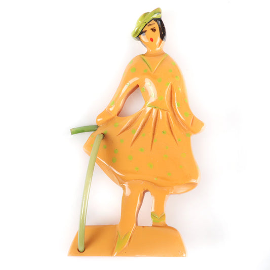 Vintage Bakelite carved figural lady / Little Bo Peep pin brooch with painted detail and celluloid cane. 3" H x 2" W