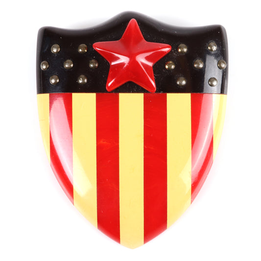 Vintage Bakelite RARE Patriotic American flag shield pin brooch, laminated stripes with applied star and metal studs. 2 1/2" X 2" W