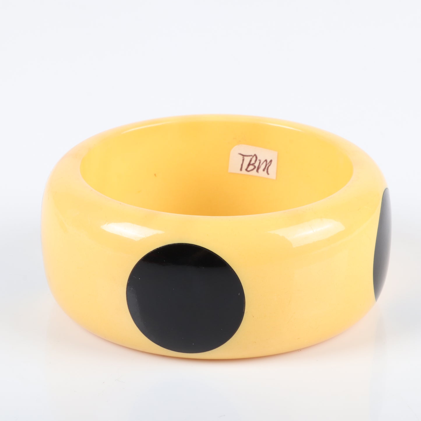 Vintage Bakelite big dot WIDE bangle bracelet in butterscotch with 4 black polka dots. 2 1/2" inner diam., 1 1/2" W