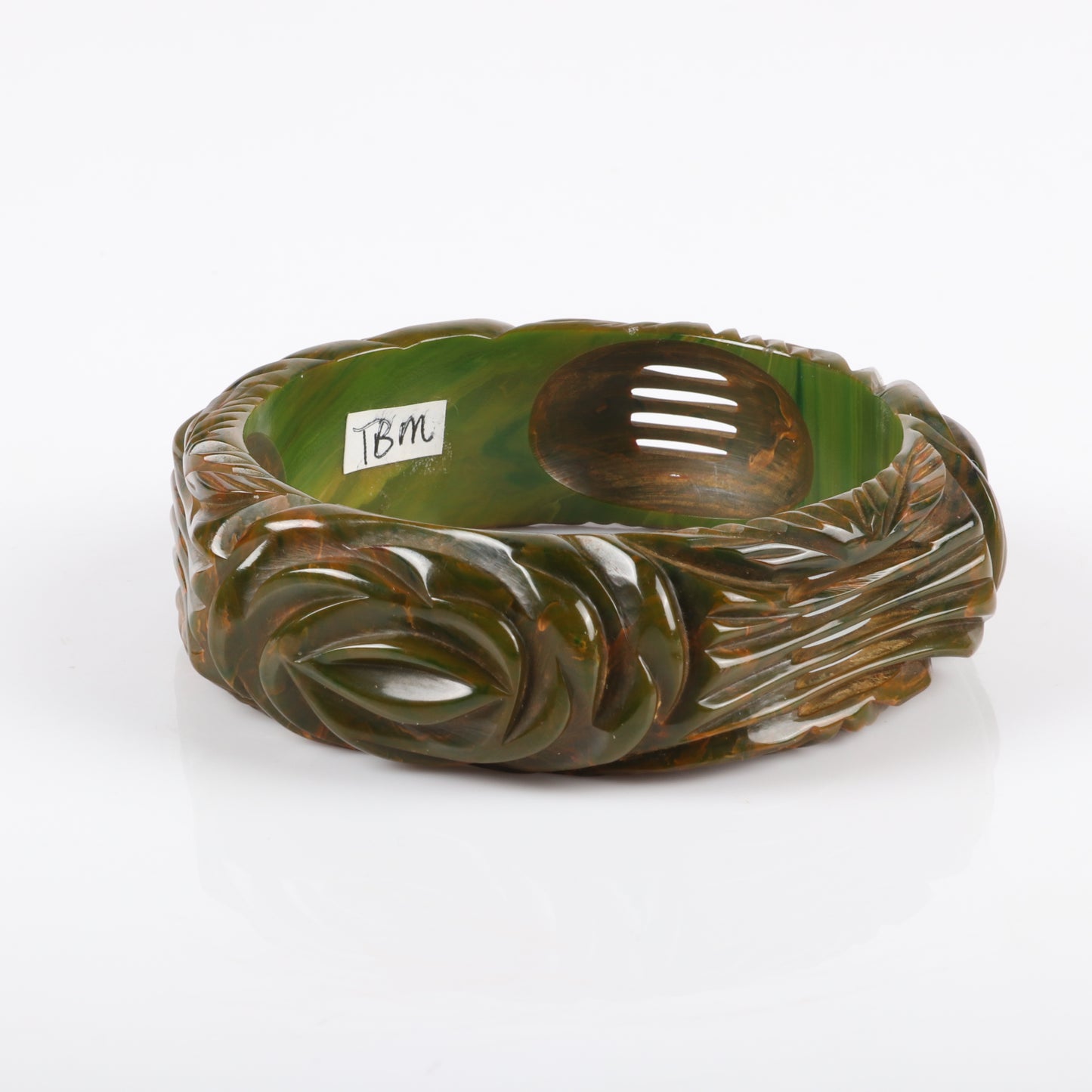 Vintage Bakelite deep pierce carved rose bangle bracelet in swirled / marbled creamed spinach with floral design. 2 1/2" inner diam., 1" W