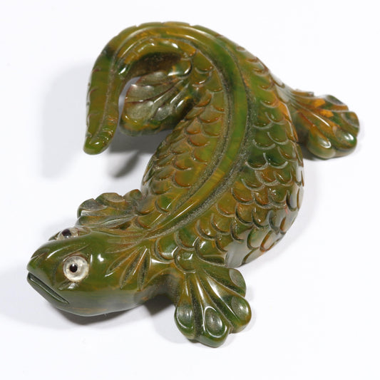 Vintage carved figural spinach Bakelite lizard brooch with glass eyes.