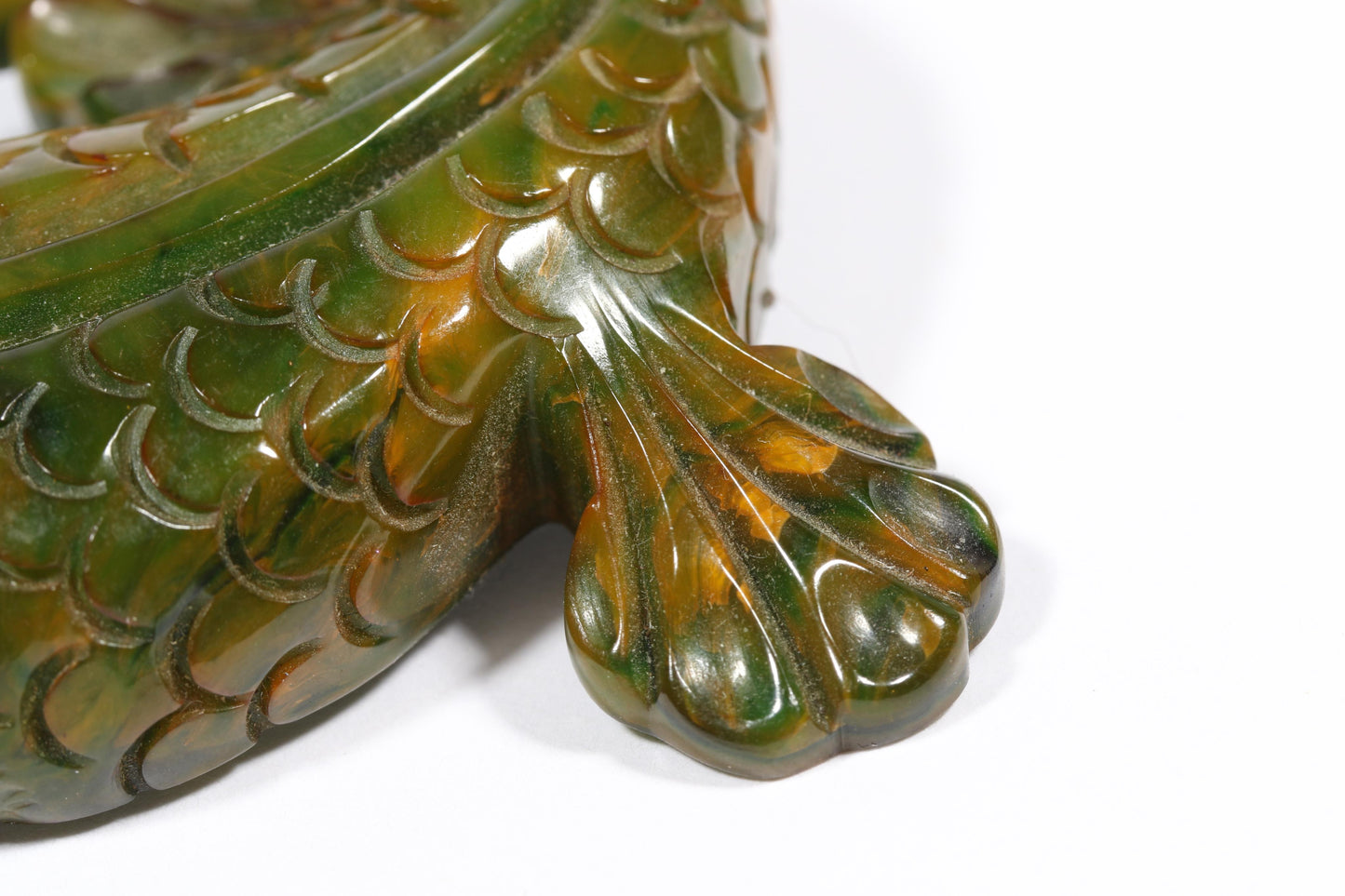 Vintage carved figural spinach Bakelite lizard brooch with glass eyes.