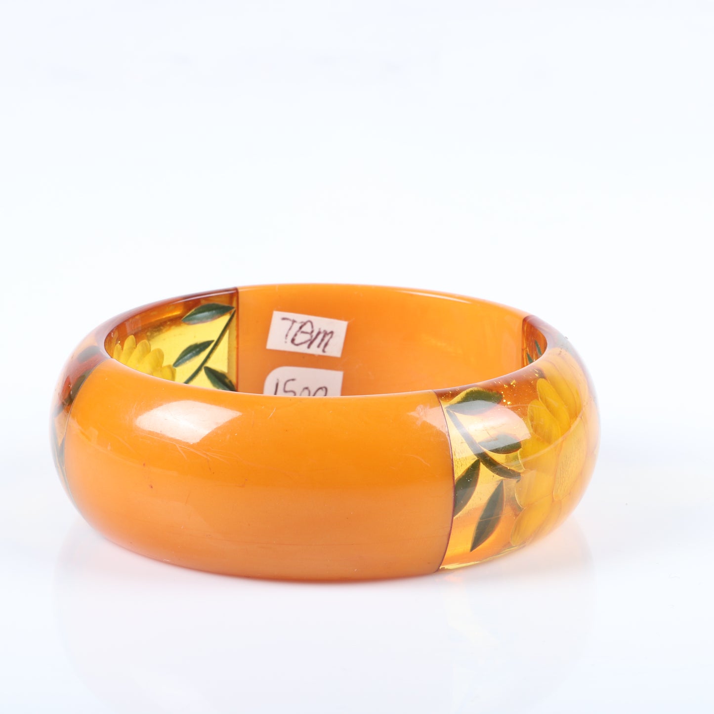 Vintage Bakelite chunky reverse carved and painted flower bangle bracelet with four laminated segments in butterscotch and apple juice. 2 1/2" inner diam., 1" W