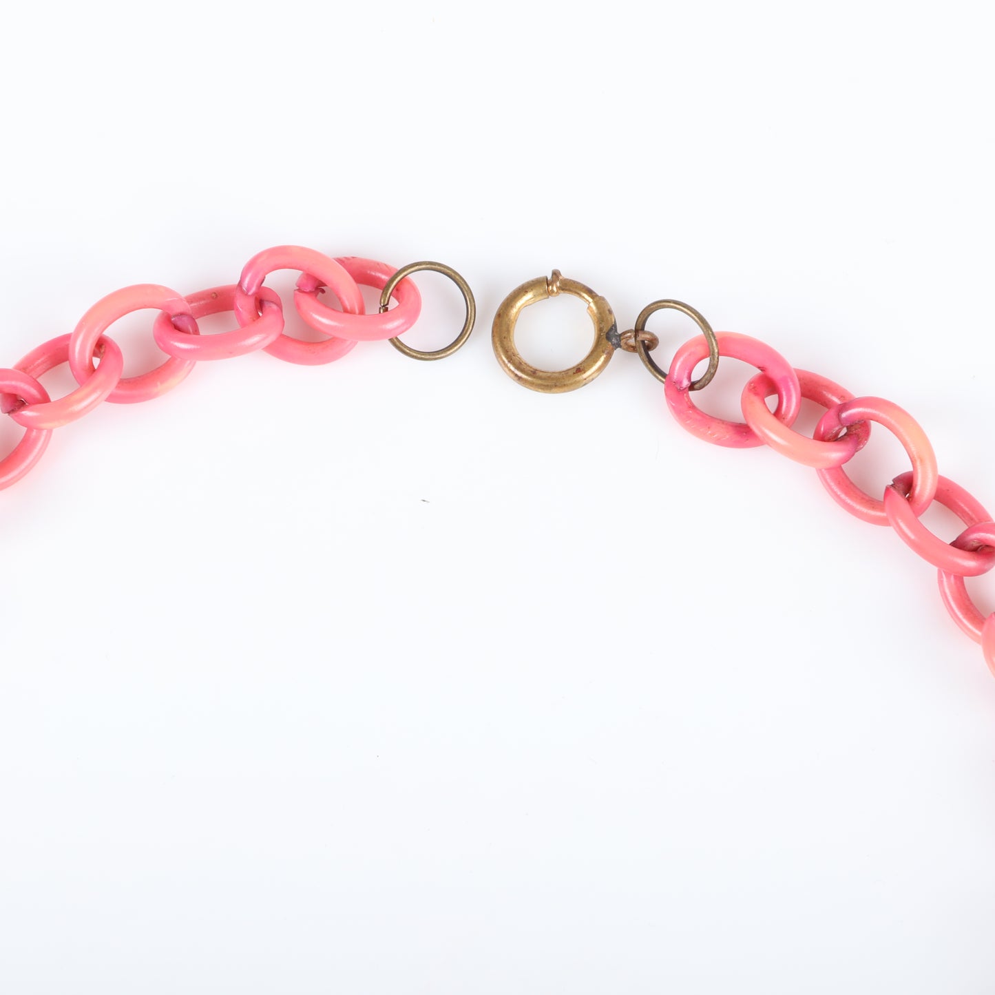 Vintage Bakelite Carmen Miranda red flat Cherry fruit charm necklace with dangling carved flat fruit charms on pink over-dyed celluloid chain with green bakelite leaves. 17 1/2" L