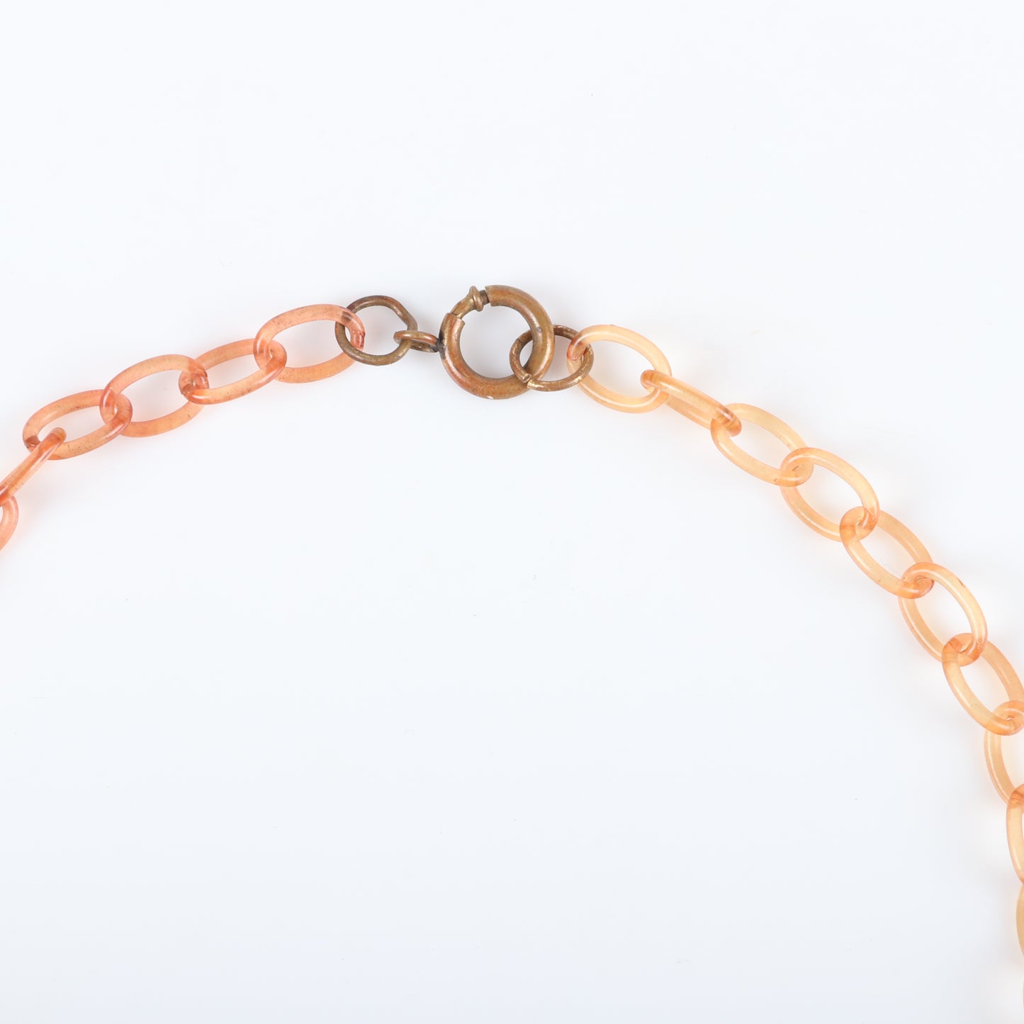 Vintage Bakelite Saturn ball charm necklace features 8 laminated sandwiched red and butterscotch dangles on apple juice celluloid chain. 17 1/2" L