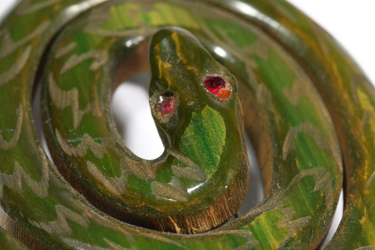 Vintage Book Piece RARE carved figural spinach Bakelite serpent snake brooch with red jeweled eyes. 2"H x 2 3/8"W