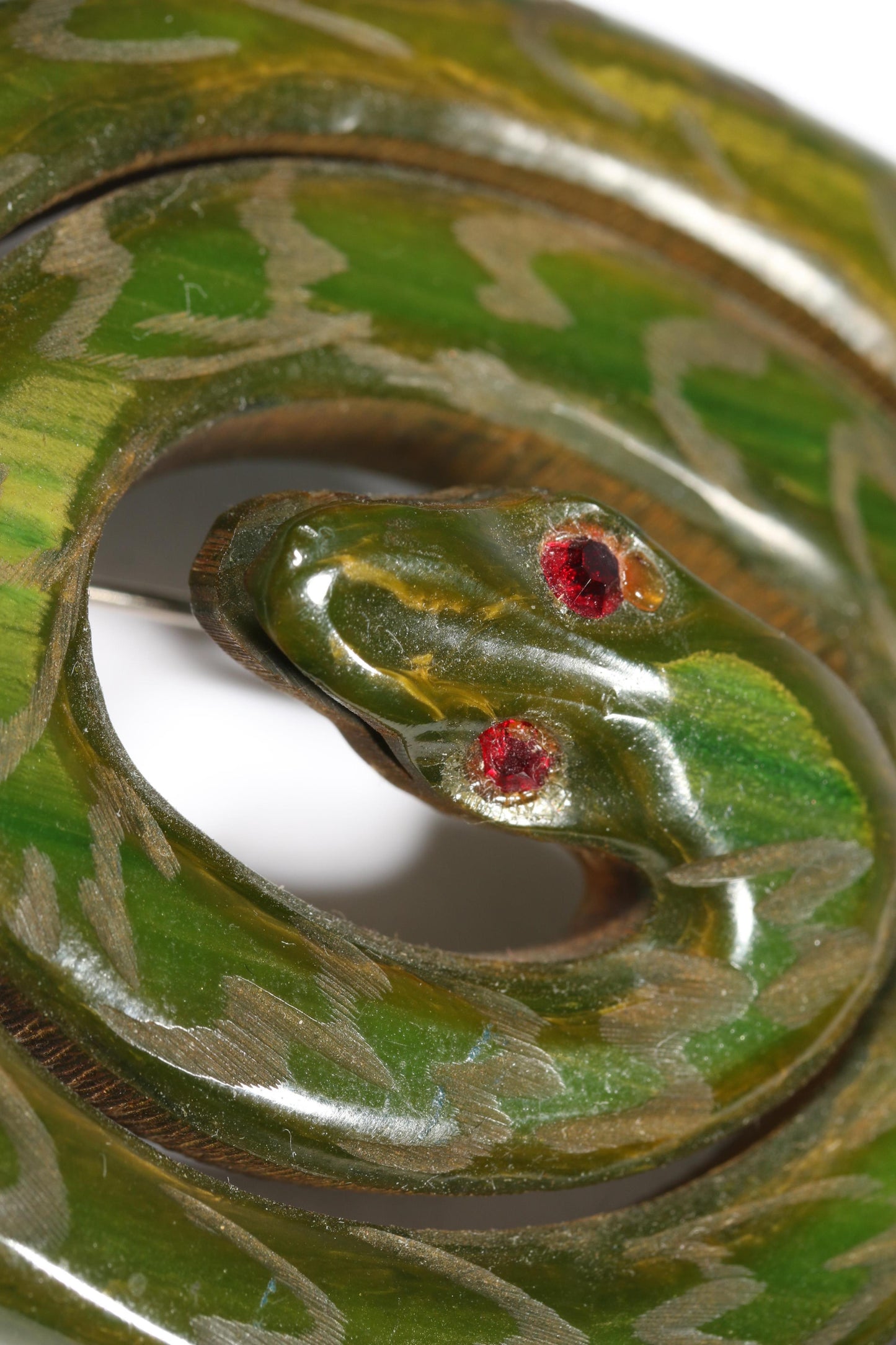Vintage Book Piece RARE carved figural spinach Bakelite serpent snake brooch with red jeweled eyes. 2"H x 2 3/8"W