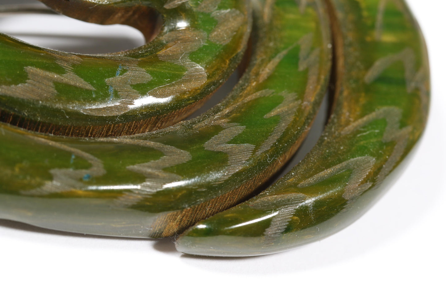 Vintage Book Piece RARE carved figural spinach Bakelite serpent snake brooch with red jeweled eyes. 2"H x 2 3/8"W