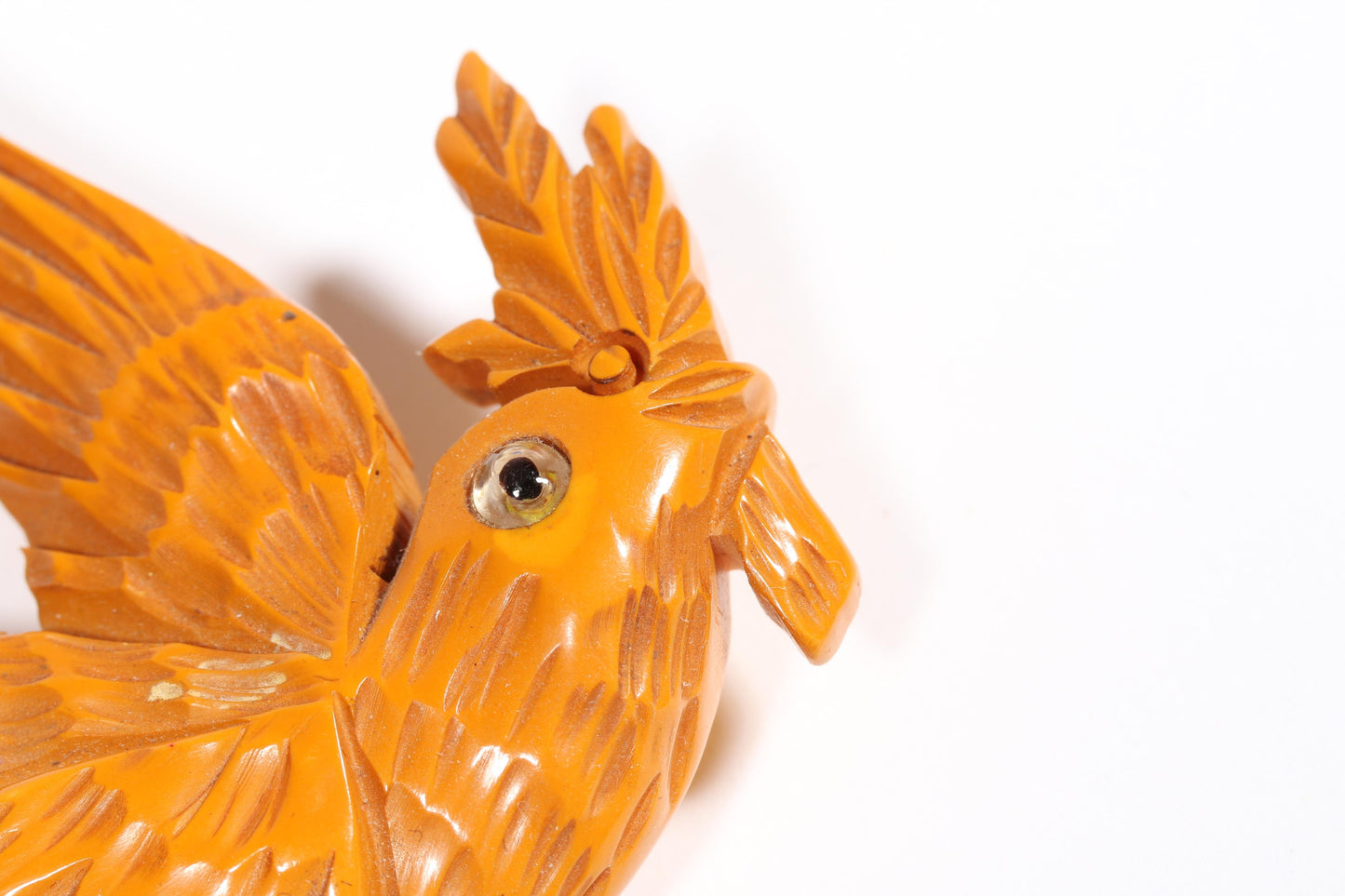 Vintage carved figural butterscotch Bakelite dove bird brooch with glass eyes. 2 1/2"H x 3"W