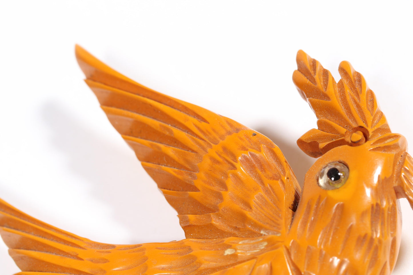 Vintage carved figural butterscotch Bakelite dove bird brooch with glass eyes. 2 1/2"H x 3"W