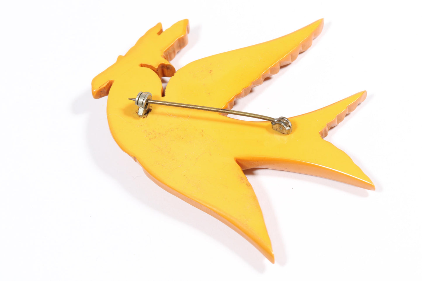 Vintage carved figural butterscotch Bakelite dove bird brooch with glass eyes. 2 1/2"H x 3"W