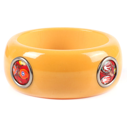 Vintage Bakelite WIDE bangle bracelet with Murano glass dots. WIDE butterscotch bangle with 4 inset Italian millefiore red art glass inlaid discs set with metal ring surround. 2 1/2" inner diam., 1 1/2" W