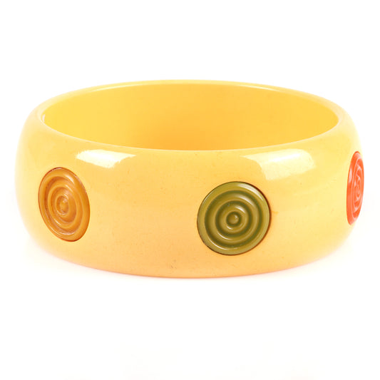 Vintage Bakelite 6 multi-color bullseye dot inset bangle bracelet. Possible glue residue. 2 1/2" inner diam., 1 1/4" W