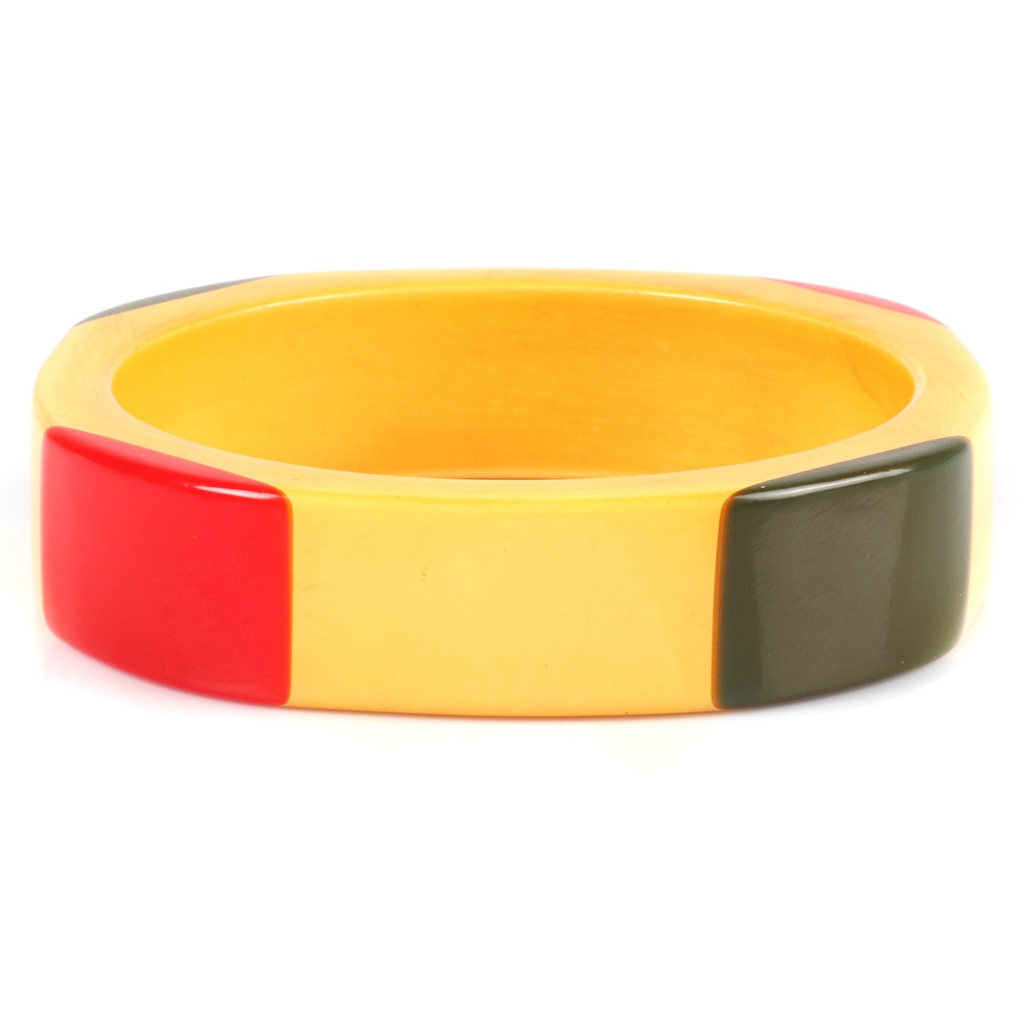 Vintage Bakelite laminated 4 sided bangle with red and green corners on cream corn colored bracelet. 2 1/2" inner diam., 3/4" W