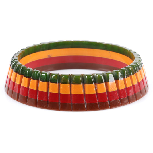 Vintage Bakelite 4 color carved laminated bangle bracelet in layers of green, cream, red, and brown. 2 3/4" inner diam.
