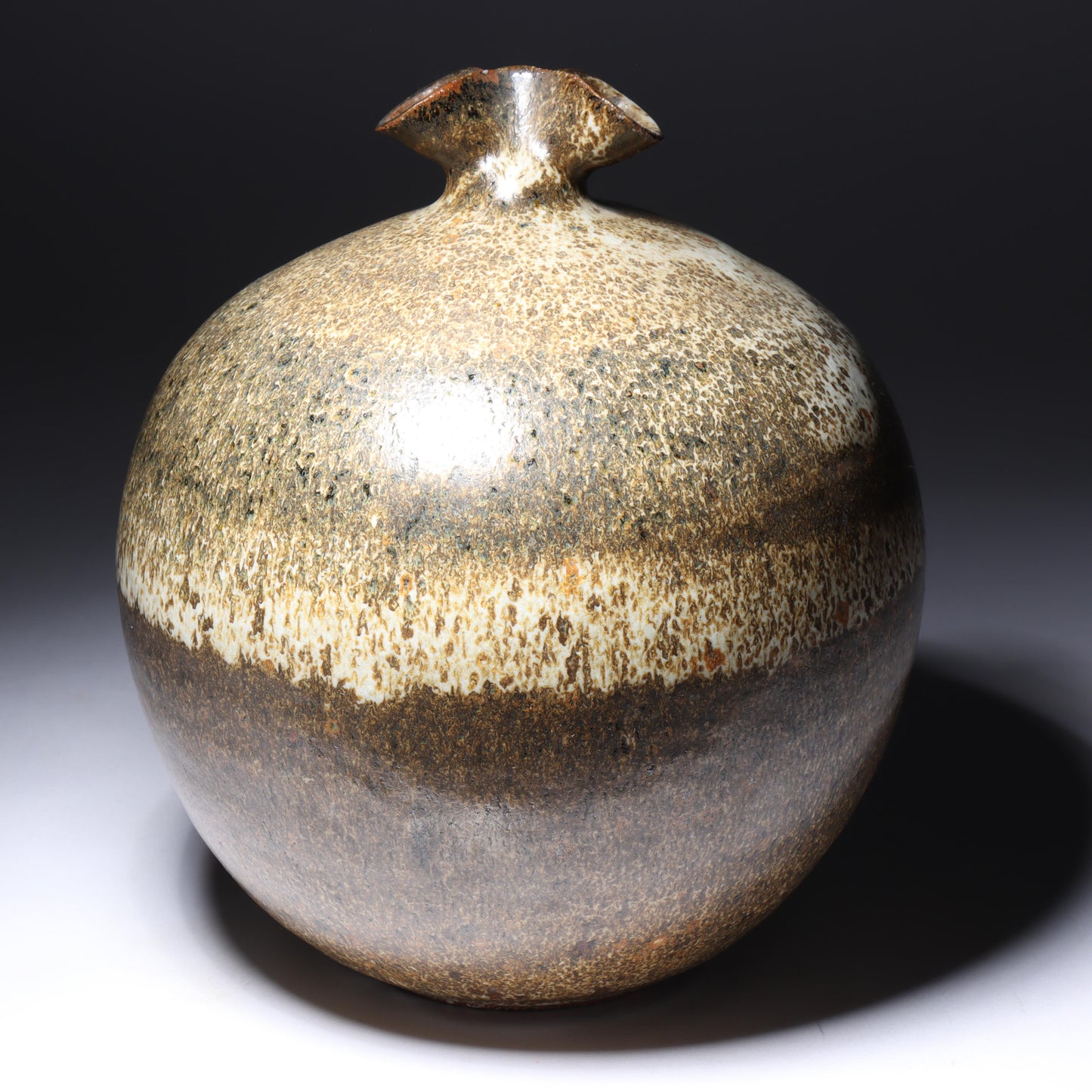 Laura Andreson, California (1902 - 1999), American studio pottery pinch neck bulbous vase, 1979, stoneware mottled banded earthtone glaze, 7 3/4"H x 6 1/2"Diam.