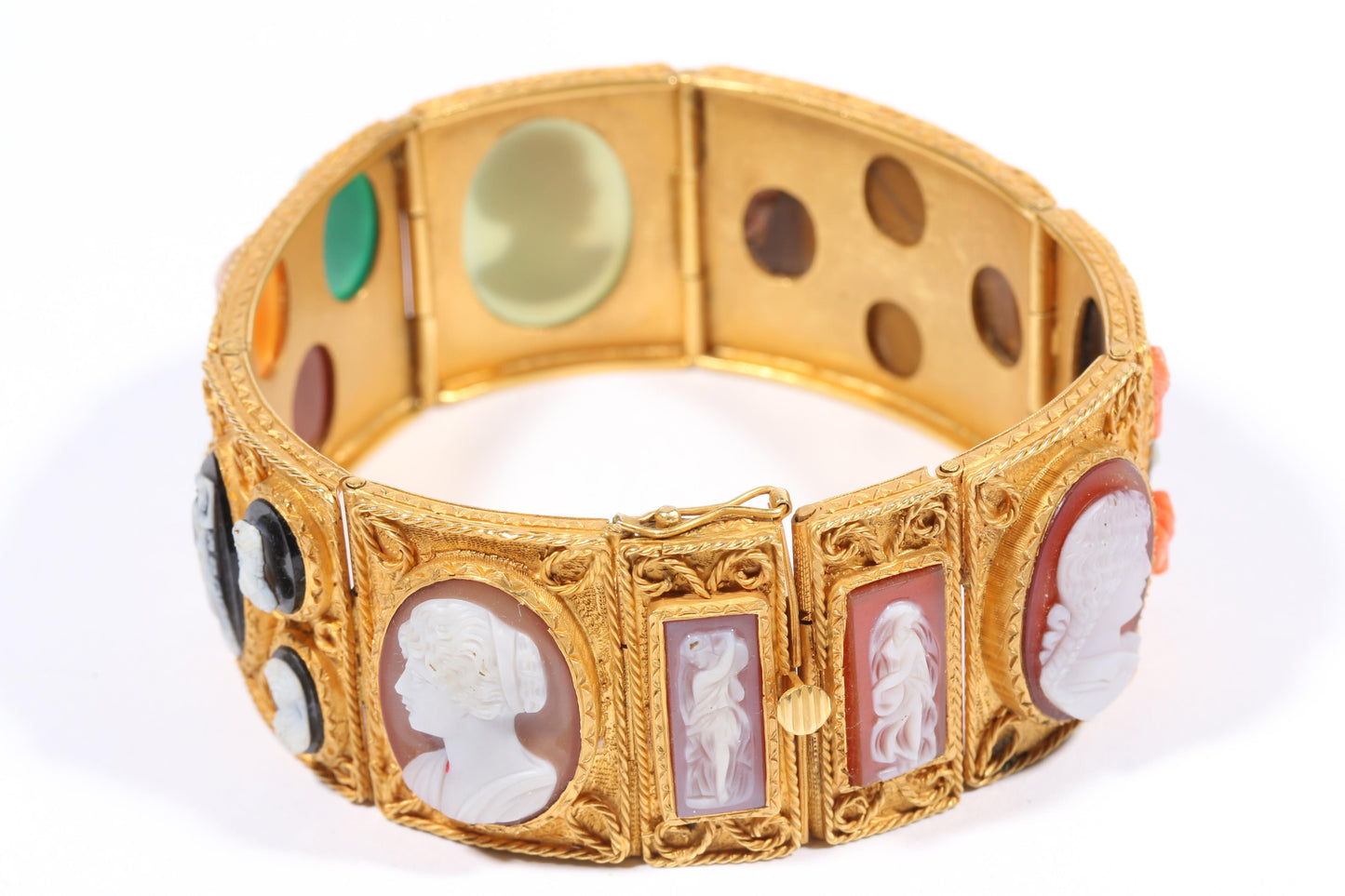 Antique 18K yellow gold Victorian panel bracelet with 19 intricate left and right facing cameos carved from natural stone including tigers eye, onyx, coral, shell, and more. 8 1/4"L x 1 1/8"W