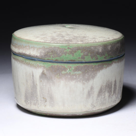 Laura Andreson, California (1902 - 1999), American studio pottery round lidded box, 1976, porcelain with complex white and gray brushed over layered sage green over blue matte glaze, 2 1/4"H x 3 1/4"Diam.