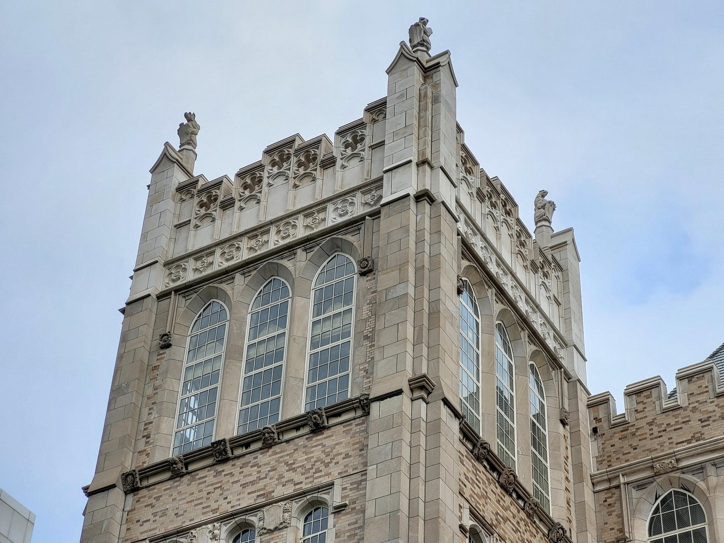 Gothic teardrop arch cornice fragment with scrolling foliate accents; 1920s Harlem, New York, Gothic Style Architectural Limestone Facade Carving 28"H x 21"W